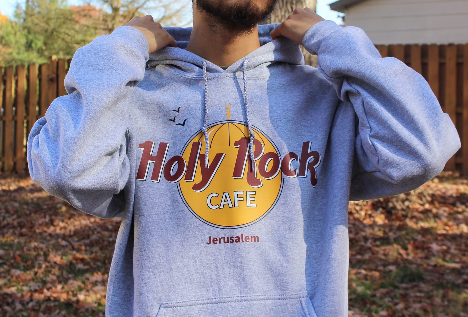 the model wearing the holy rock hoodie