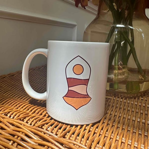 the front of the mug with sunset design